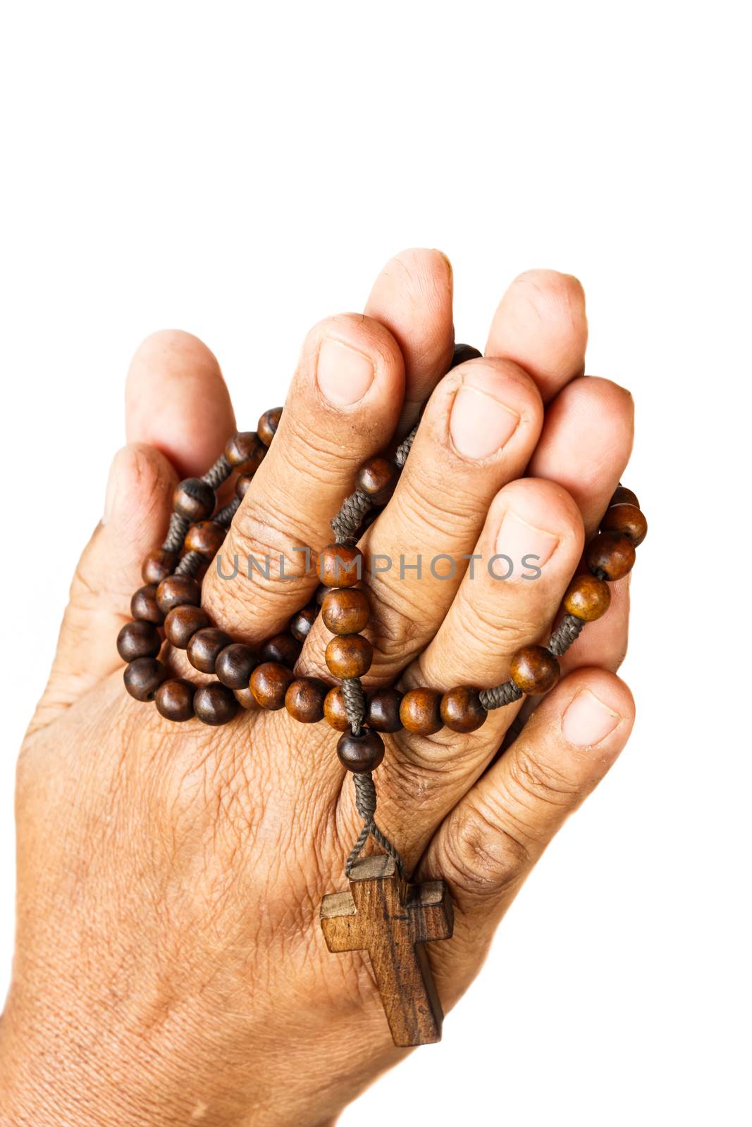 hands of old aged human were binded by wood rosary on white background (isolated)