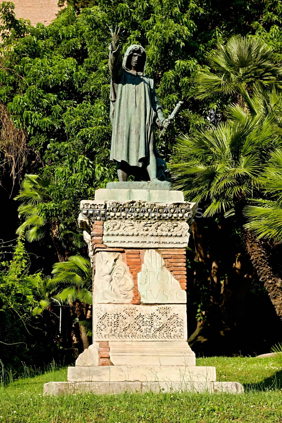 Photo shows details of city statue in the park.