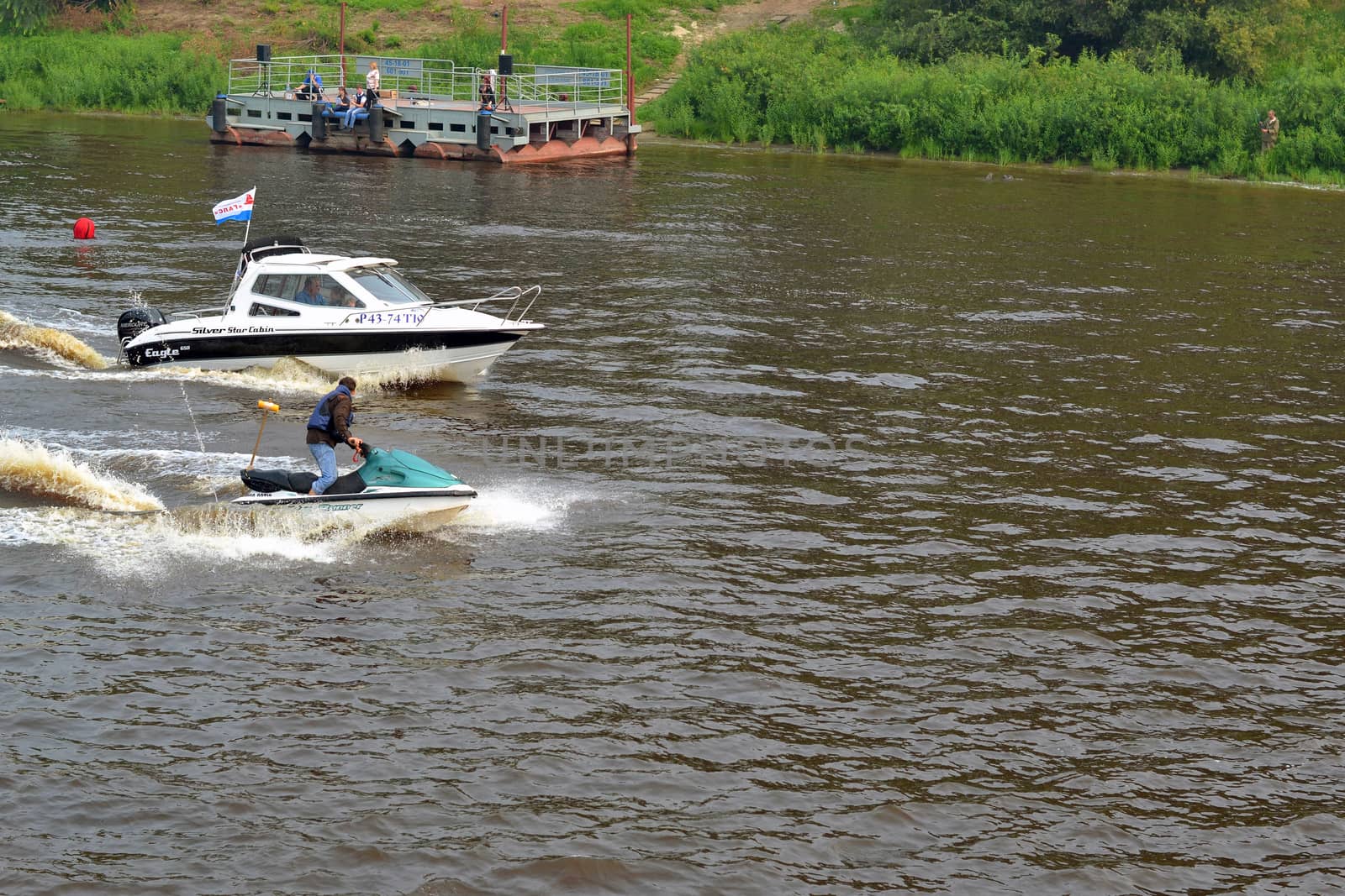 The man on a hydrocycle floats down the river