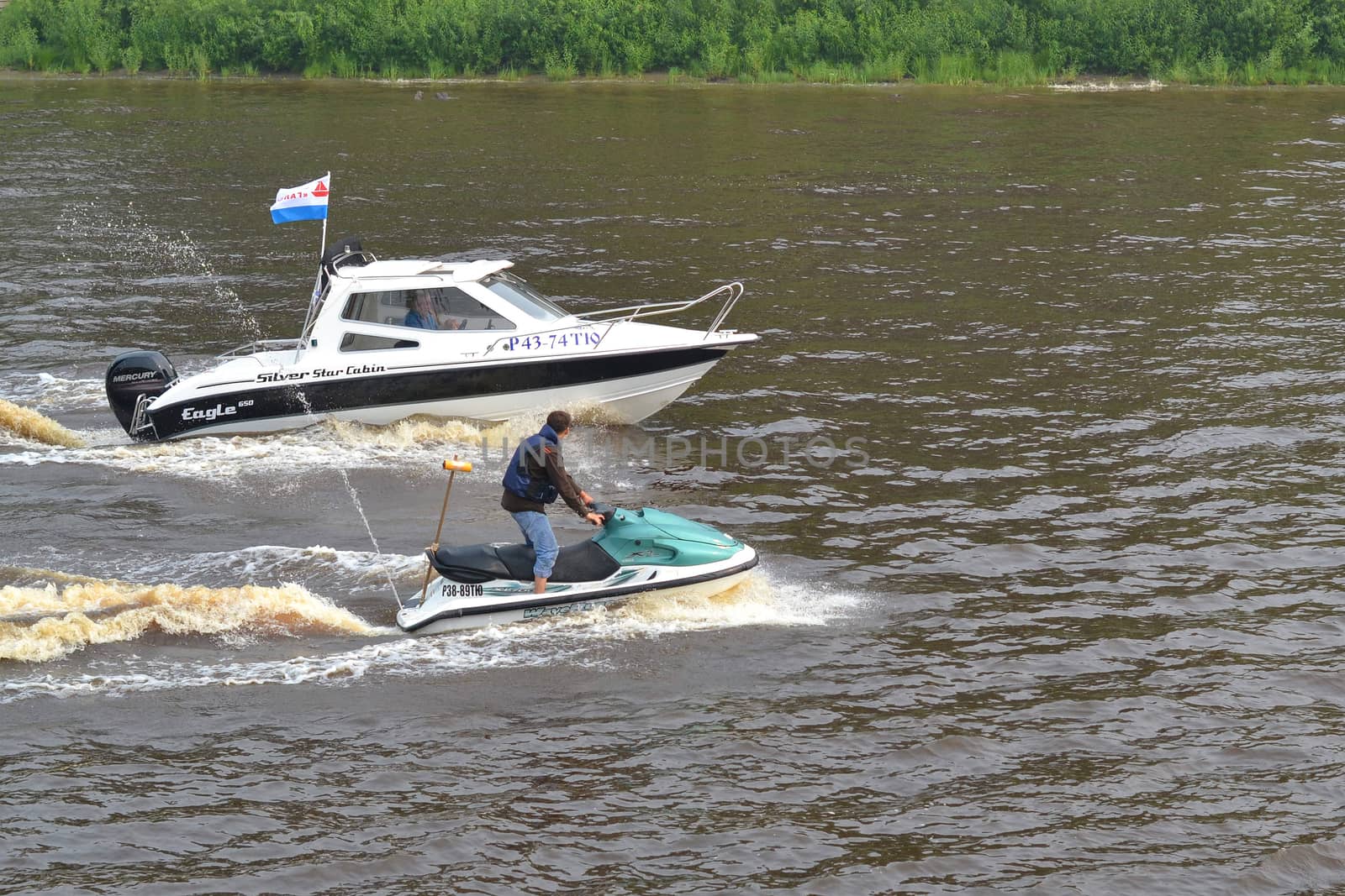 The man on a hydrocycle floats down the river
