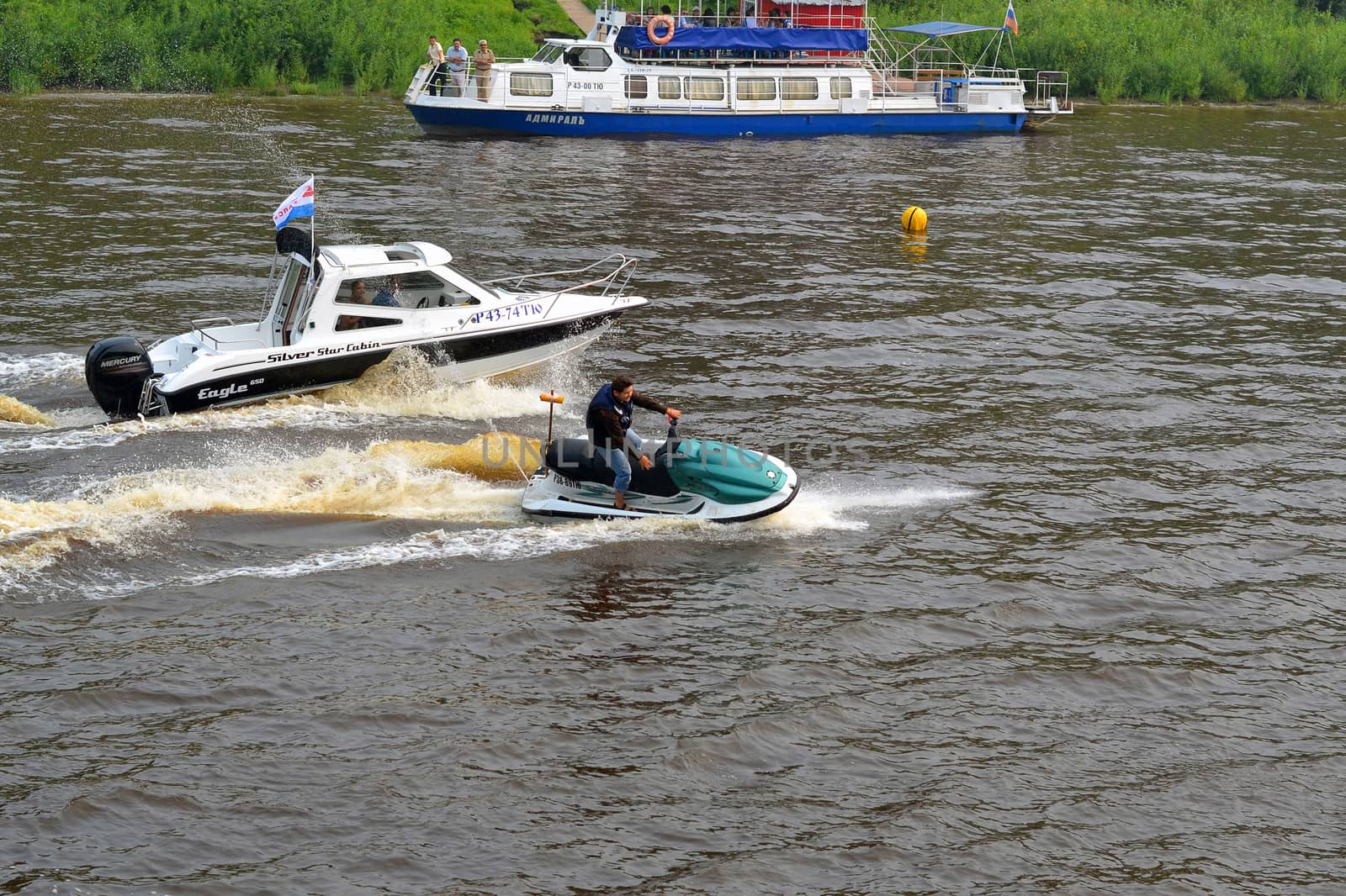The man on a hydrocycle floats down the river