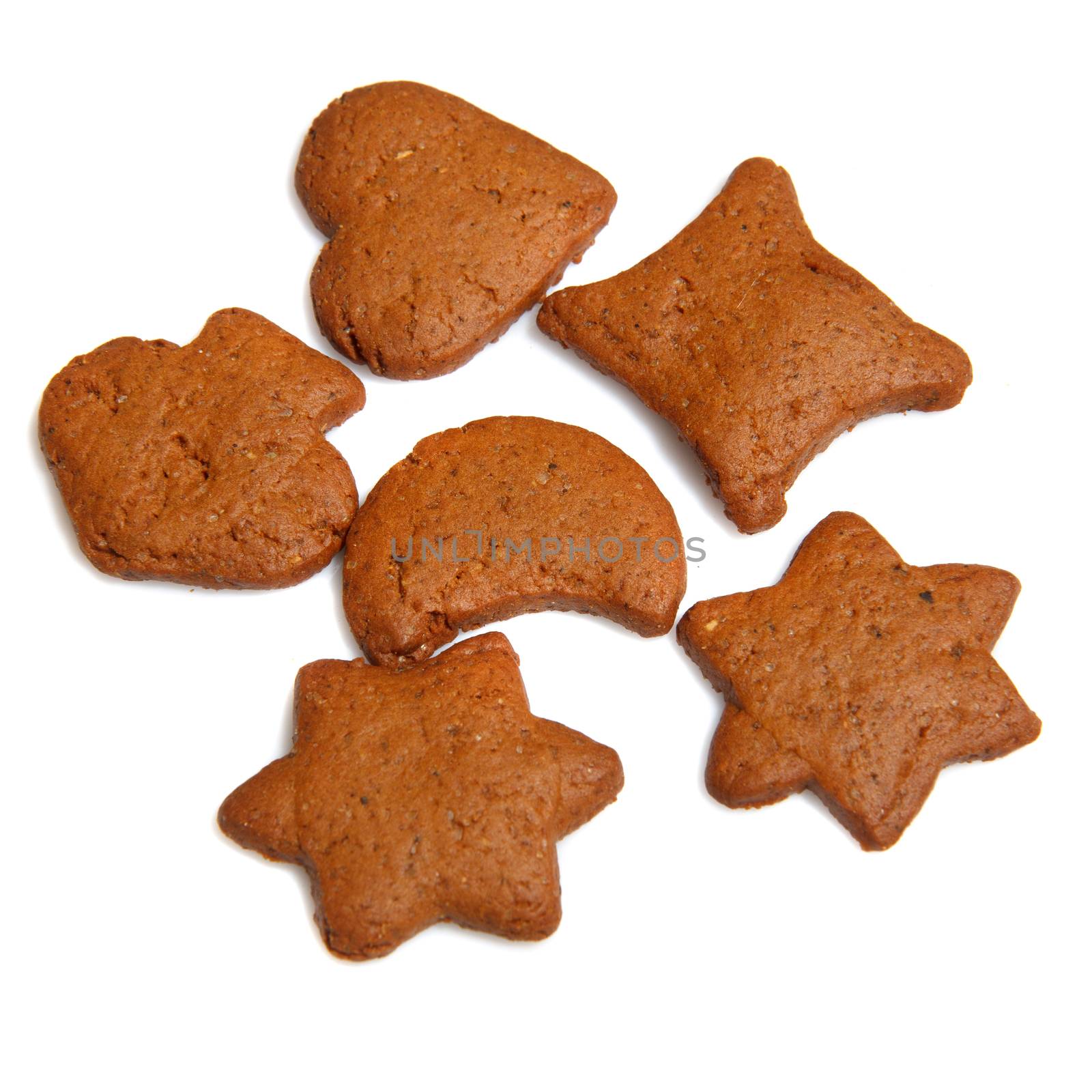 A bunch of homemade undecorated jingerbread on white background