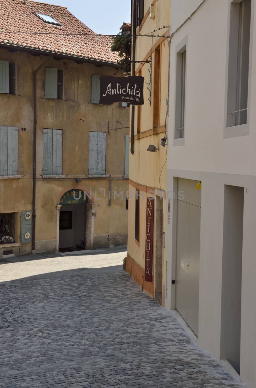 Traditional street in the historical part of the town of Bassano del Grappa, Northern Italy