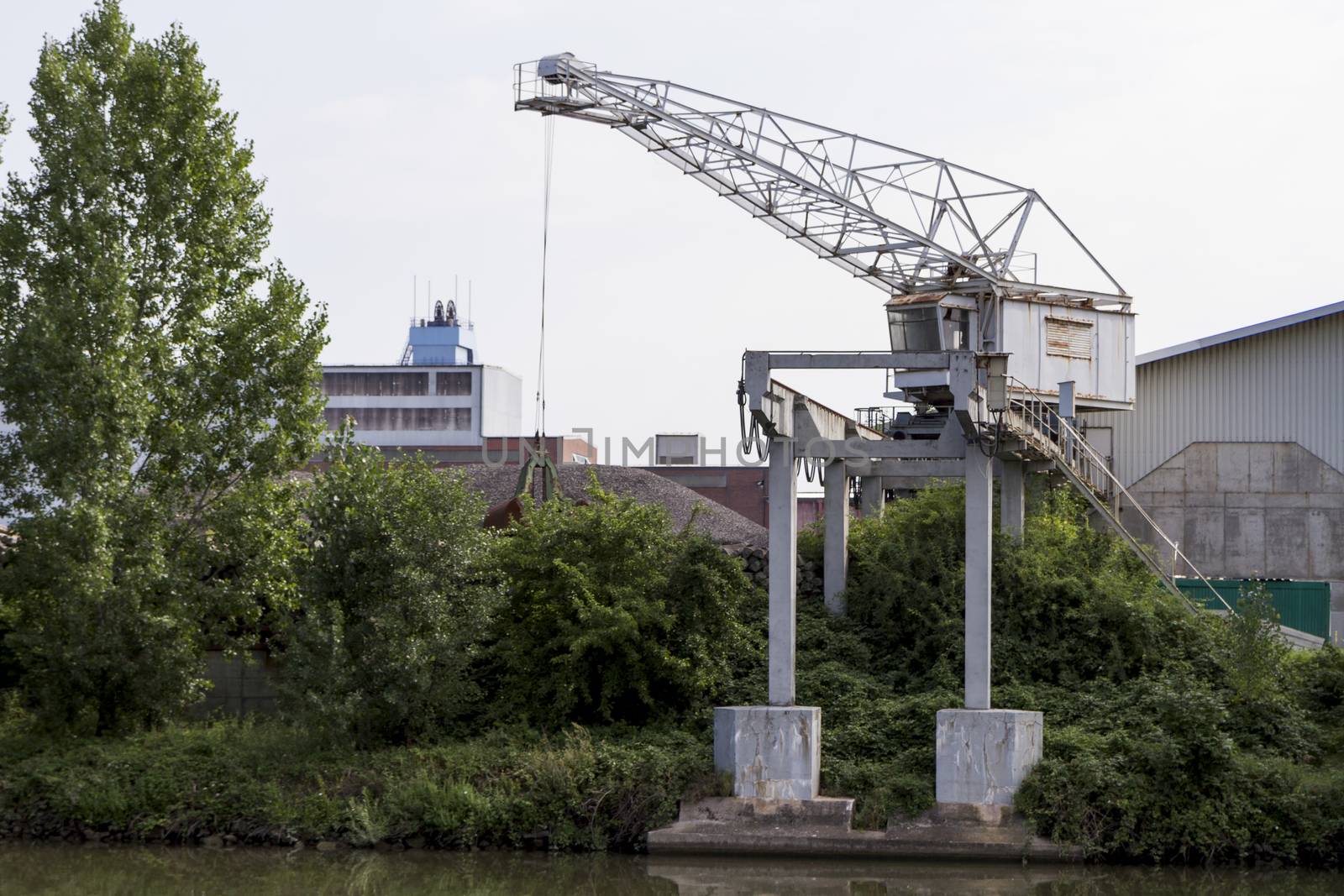 small, old dockside crane at river Neckar in germany