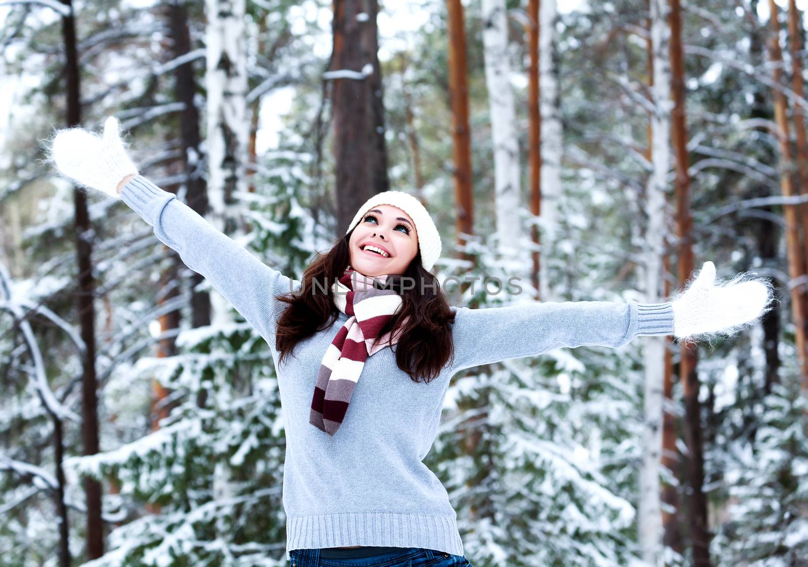 Happy woman in a winter forest