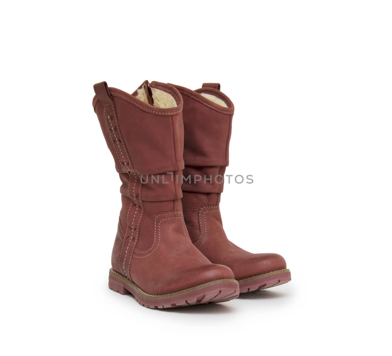 pair of boots isolated on a white background by cocoo