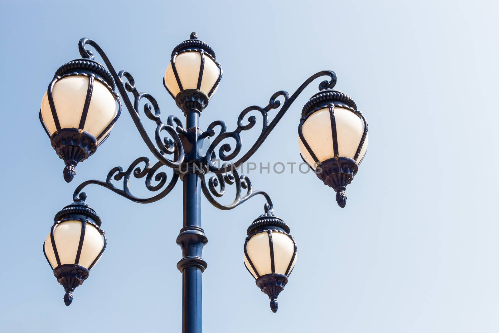 the street lamp and blue sky with blank area at right side