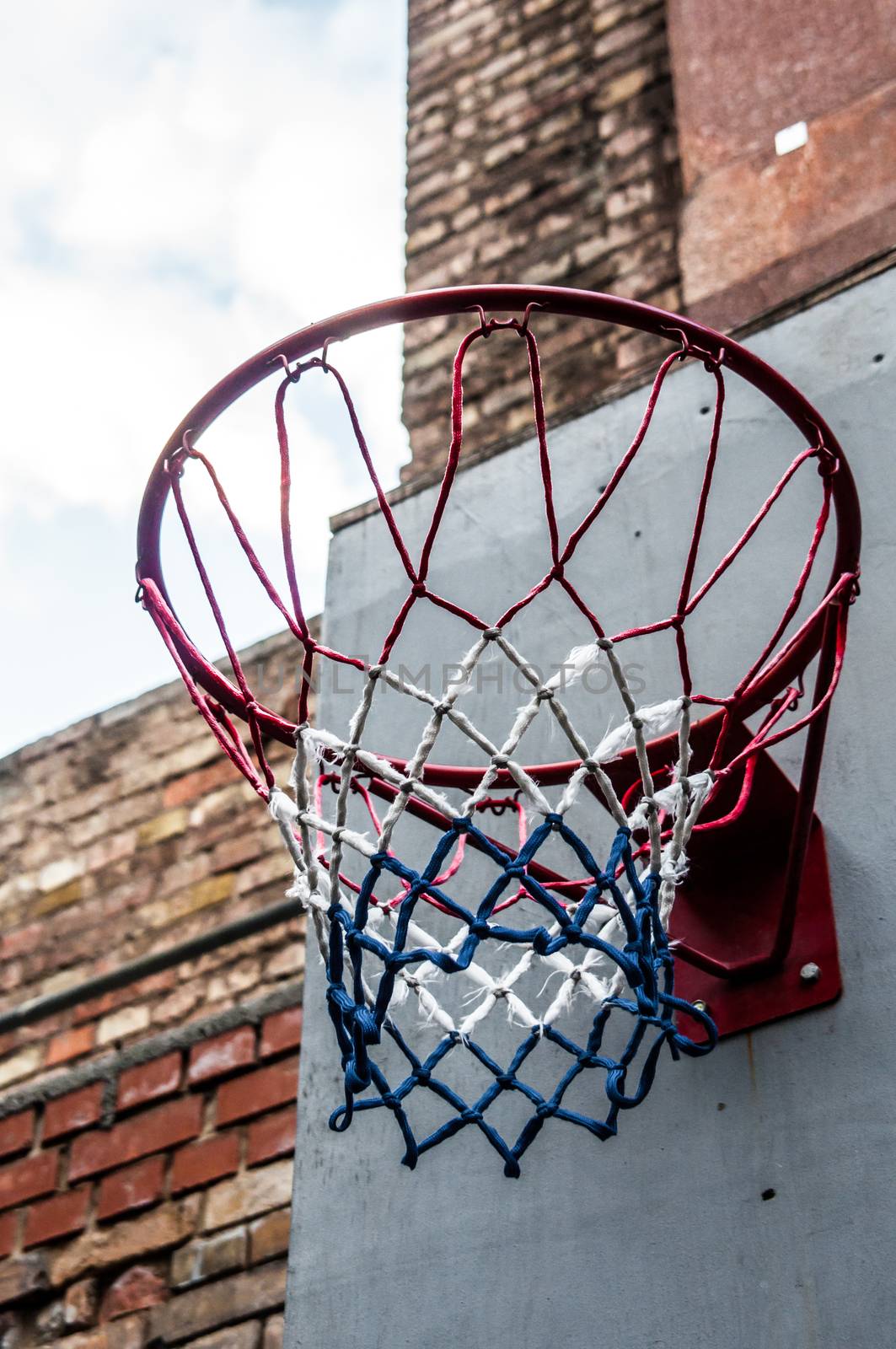 view of an old basketball hoop from below