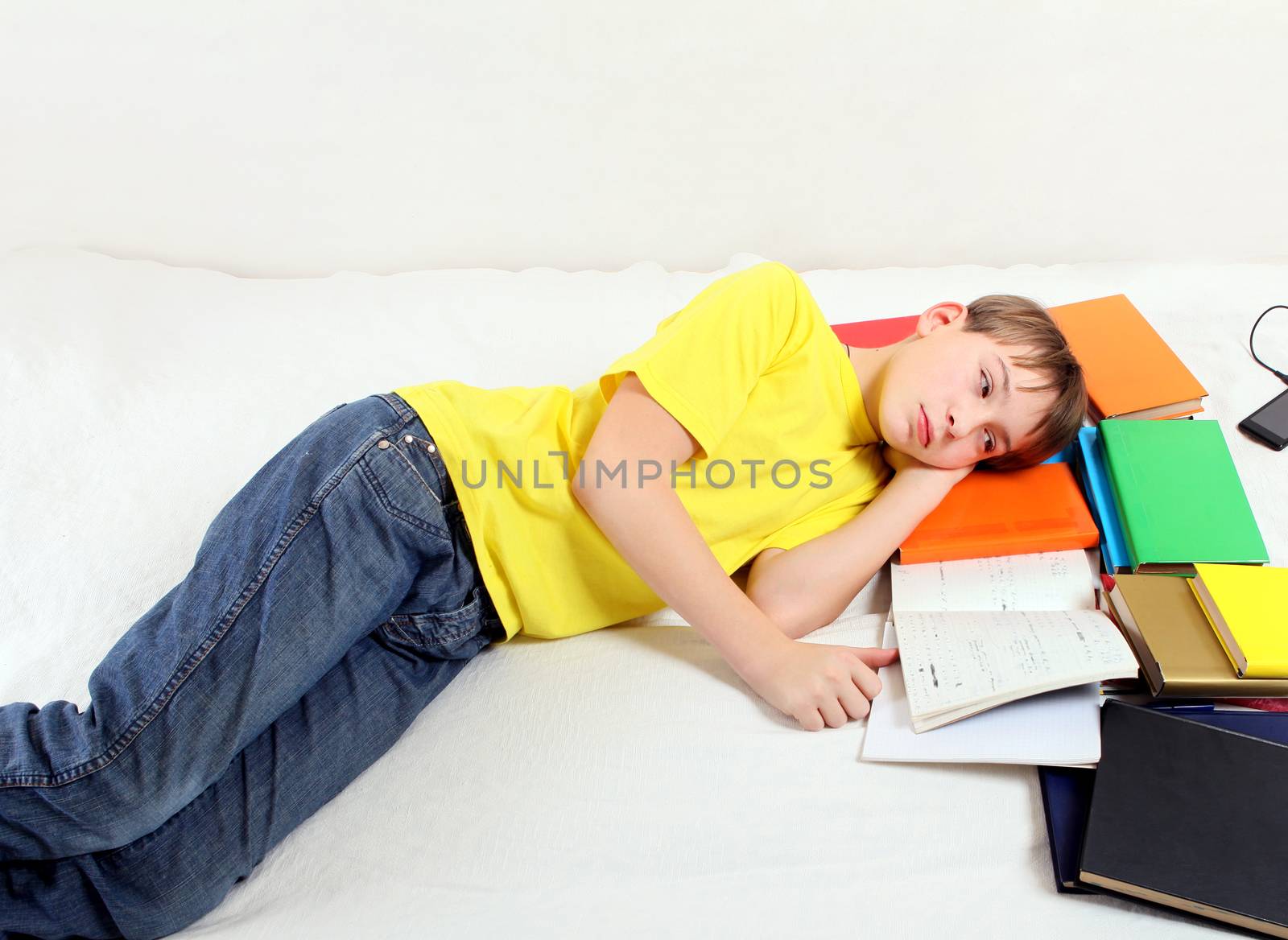 Tired Teenager with a Books by sabphoto