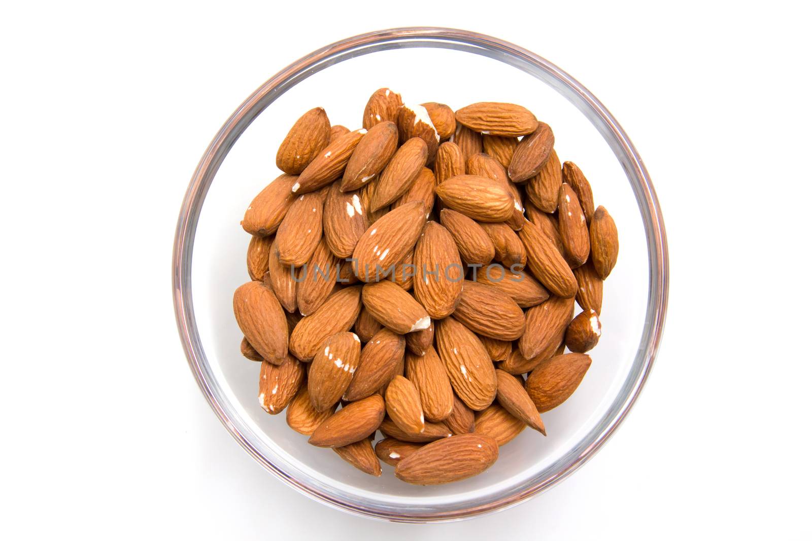 Almonds in bowl from above by spafra