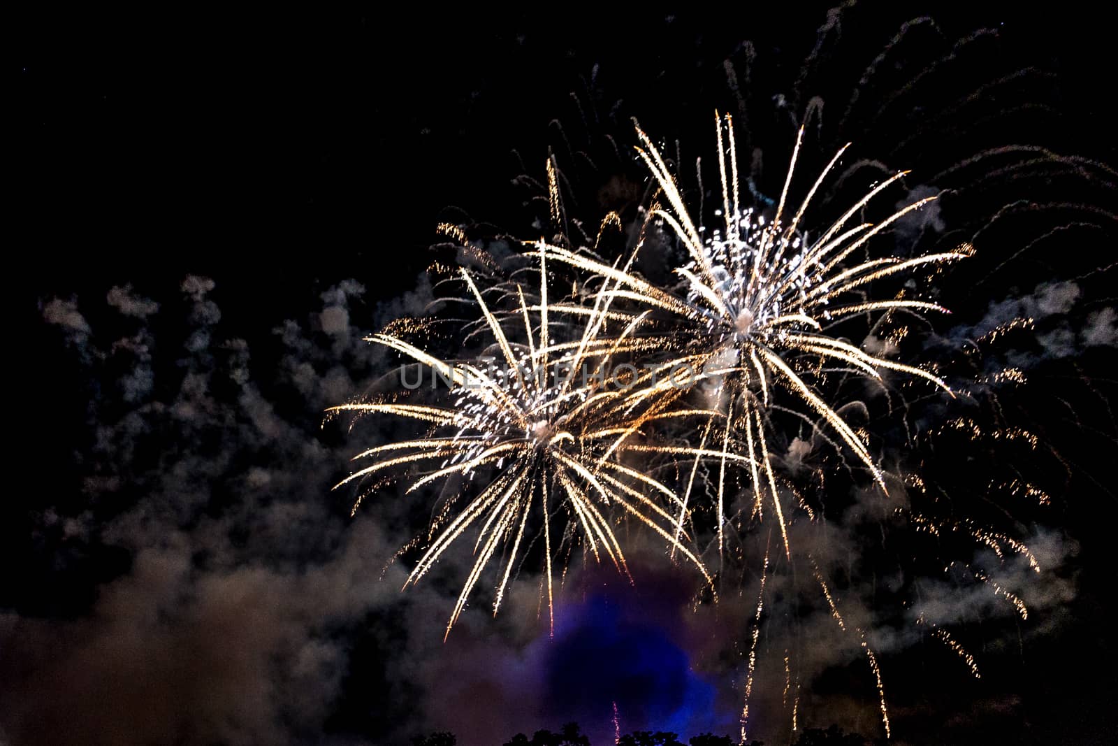 A close-up shot of sparkling Fireworks bursting out into beautiful shapes