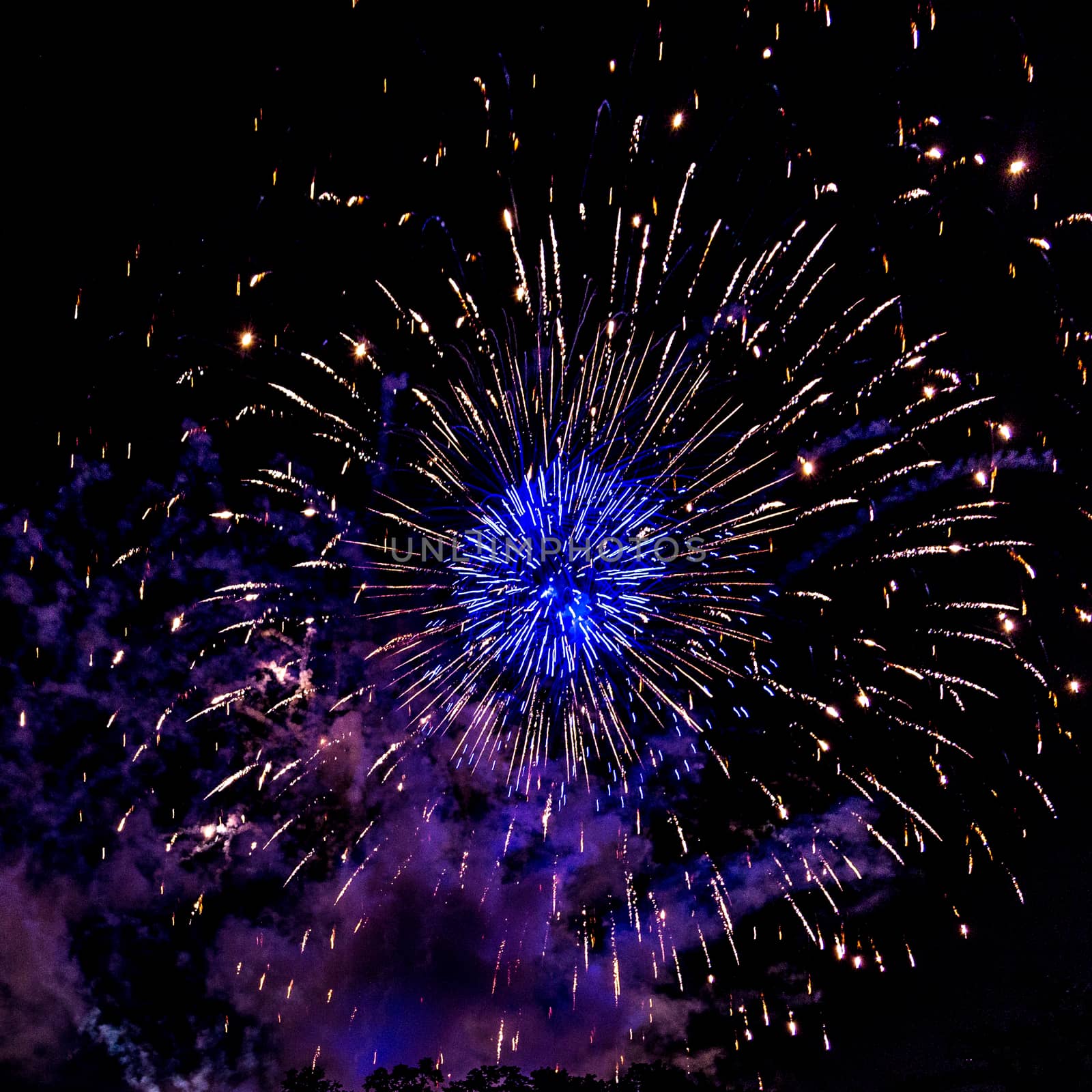 A close-up shot of sparkling Fireworks bursting out into beautiful shapes