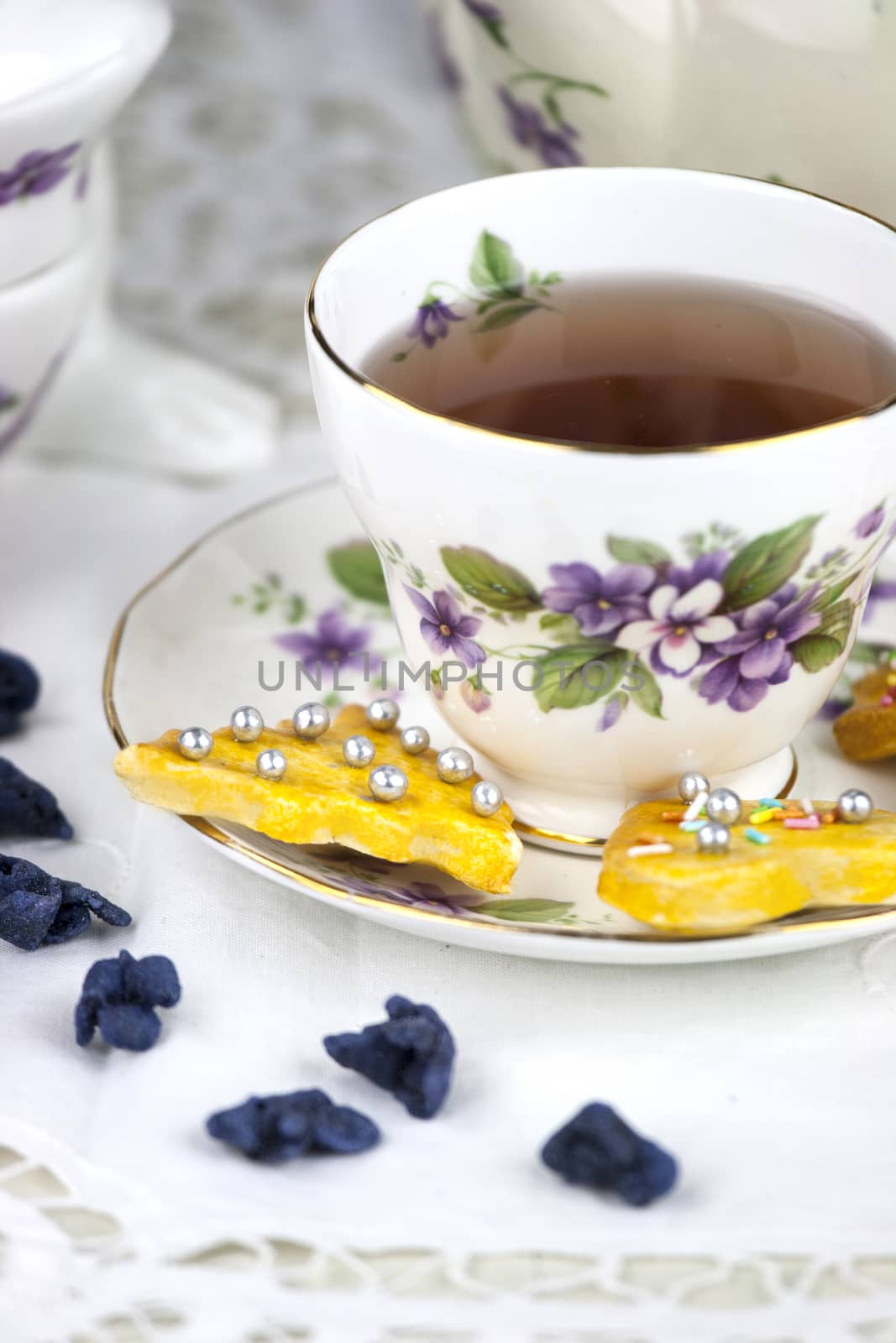 English afternoon tea with cookies and candied violets