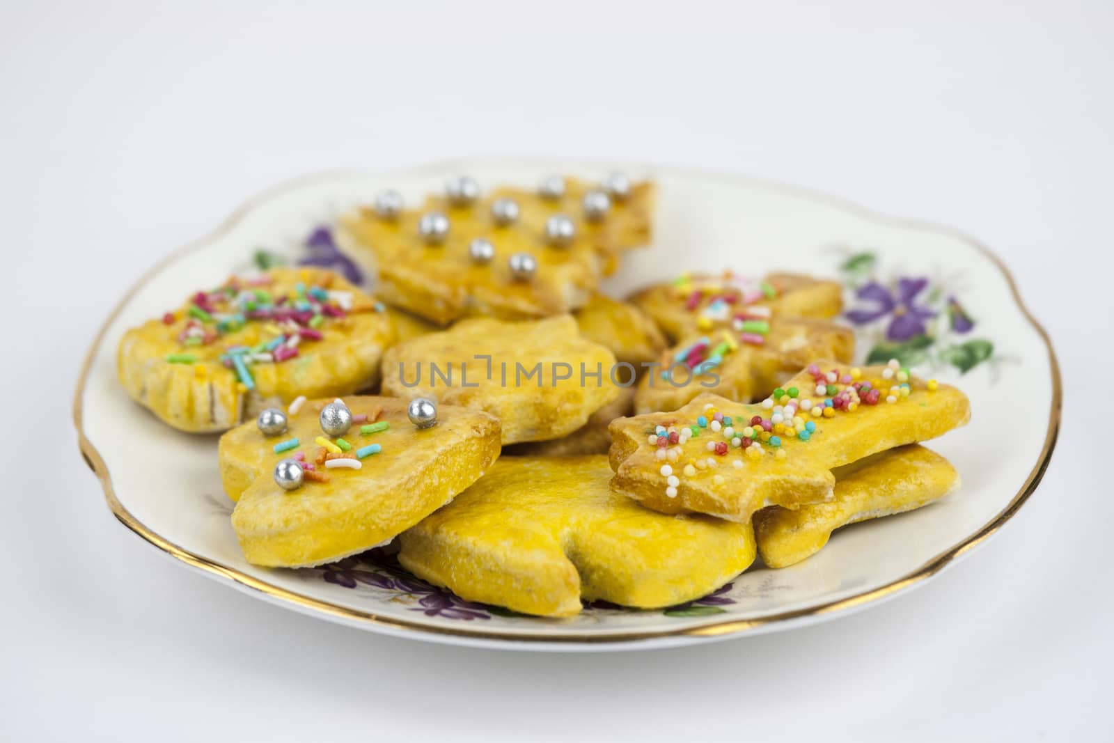 Sweet and decored cookies over a white background