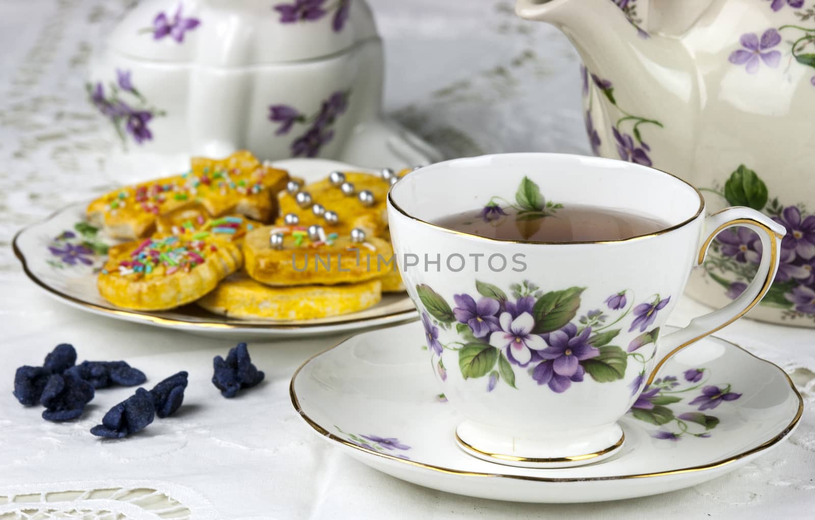 English afternoon tea with cookies and candied violets