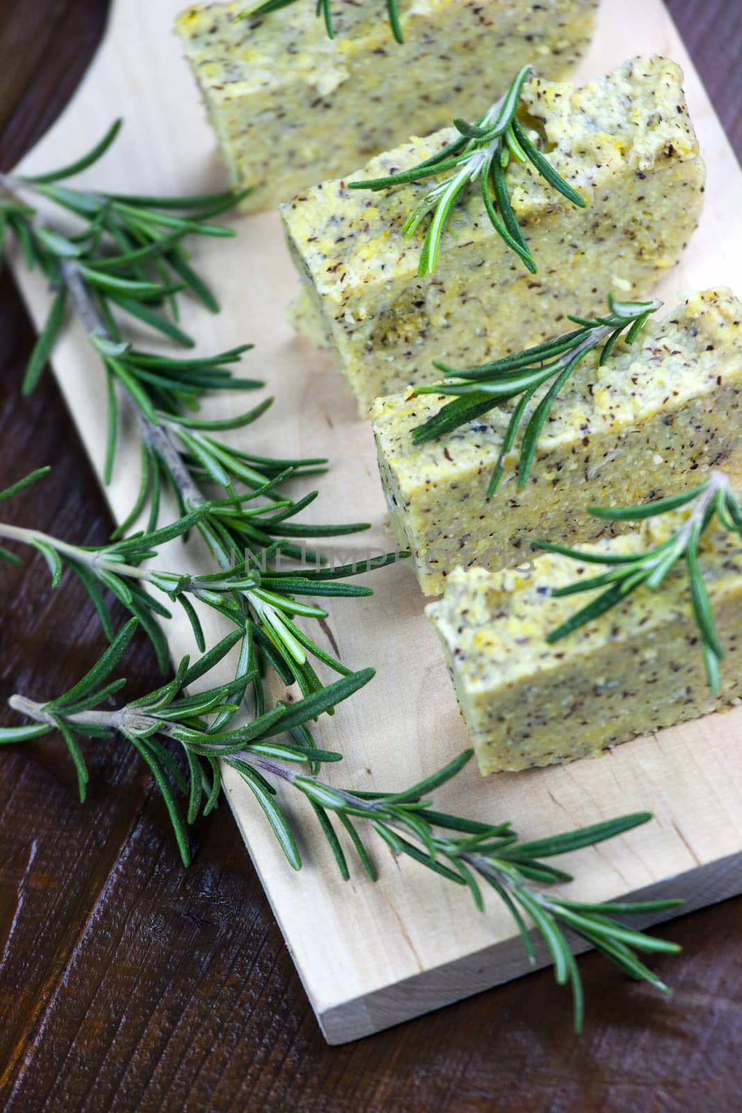 Baked polenta "taragna" (corn and buckwheat flours) with italian cheese (taleggio, gorgonzola, parmigiano reggiano) and rosemary