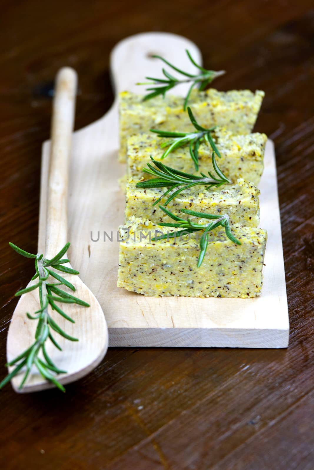 Baked polenta with italian cheese and rosemary by stefanoventuri