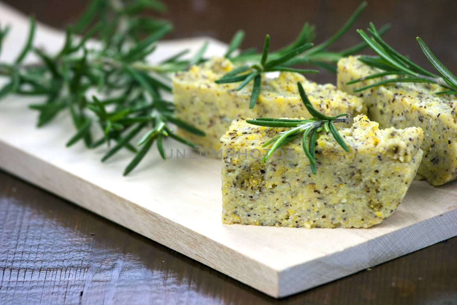 Baked polenta "taragna" (corn and buckwheat flours) with italian cheese (taleggio, gorgonzola, parmigiano reggiano) and rosemary