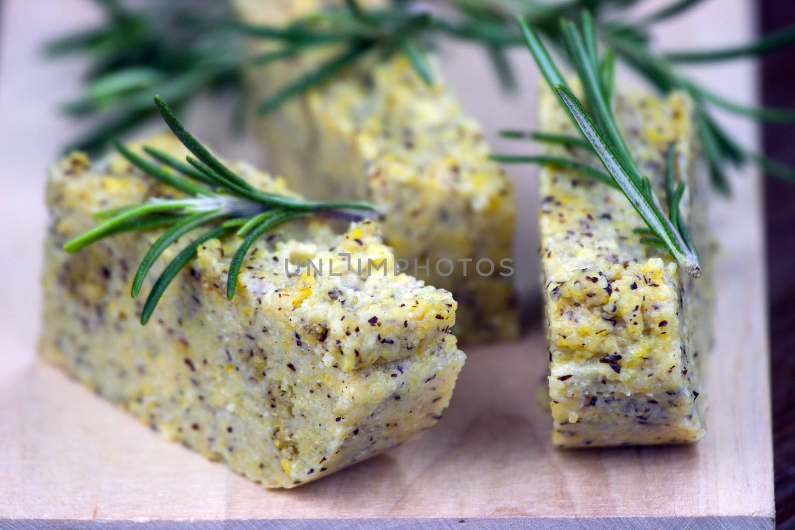 Baked polenta "taragna" (corn and buckwheat flours) with italian cheese (taleggio, gorgonzola, parmigiano reggiano) and rosemary