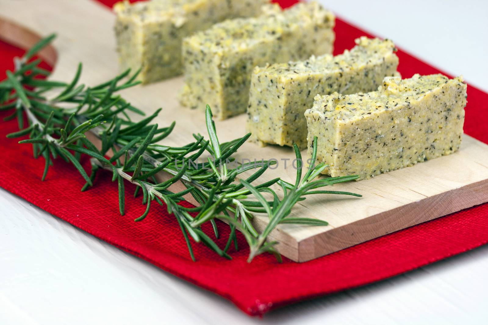 Baked polenta "taragna" (corn and buckwheat flours) with italian cheese (taleggio, gorgonzola, parmigiano reggiano) and rosemary