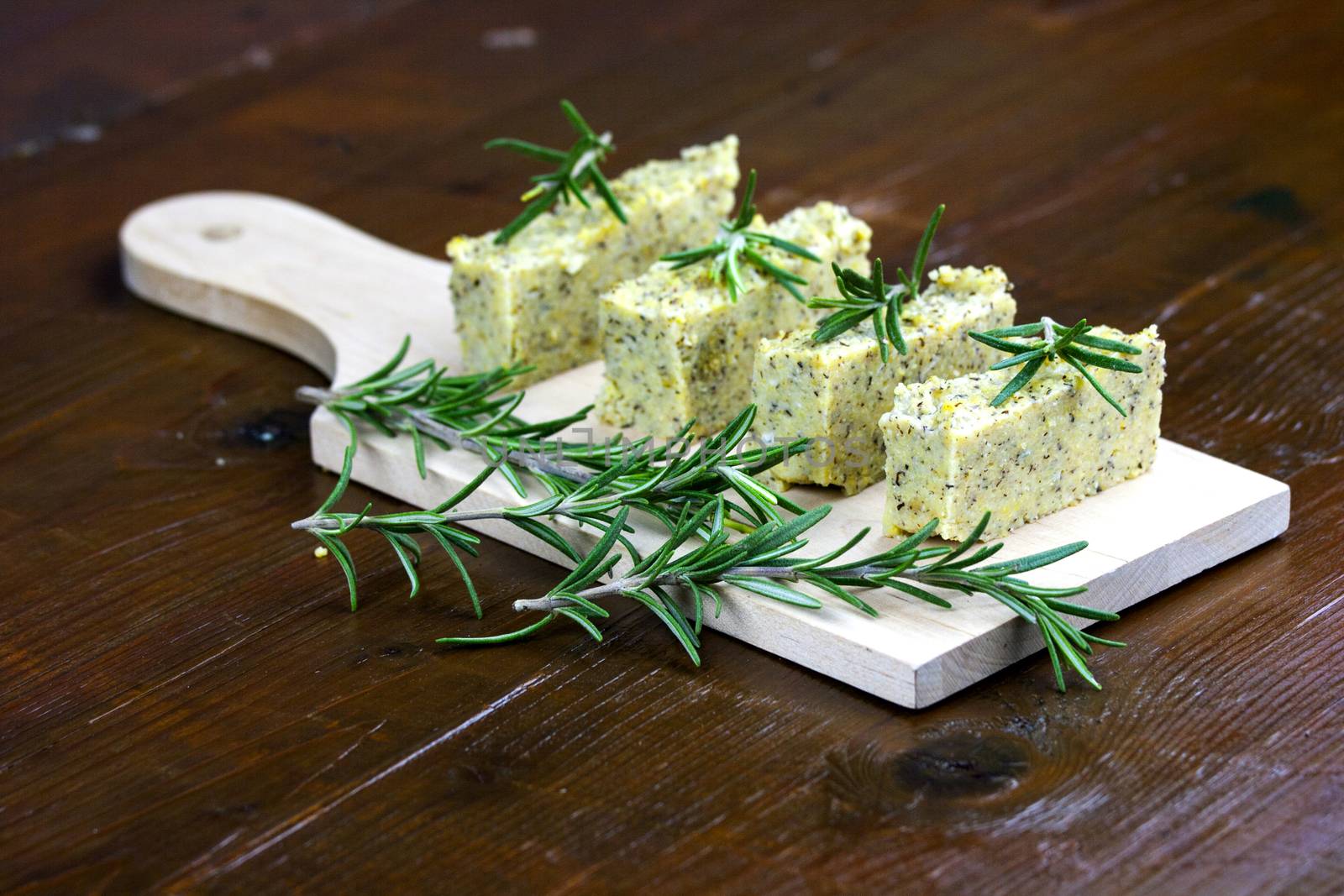 Baked polenta "taragna" (corn and buckwheat flours) with italian cheese (taleggio, gorgonzola, parmigiano reggiano) and rosemary