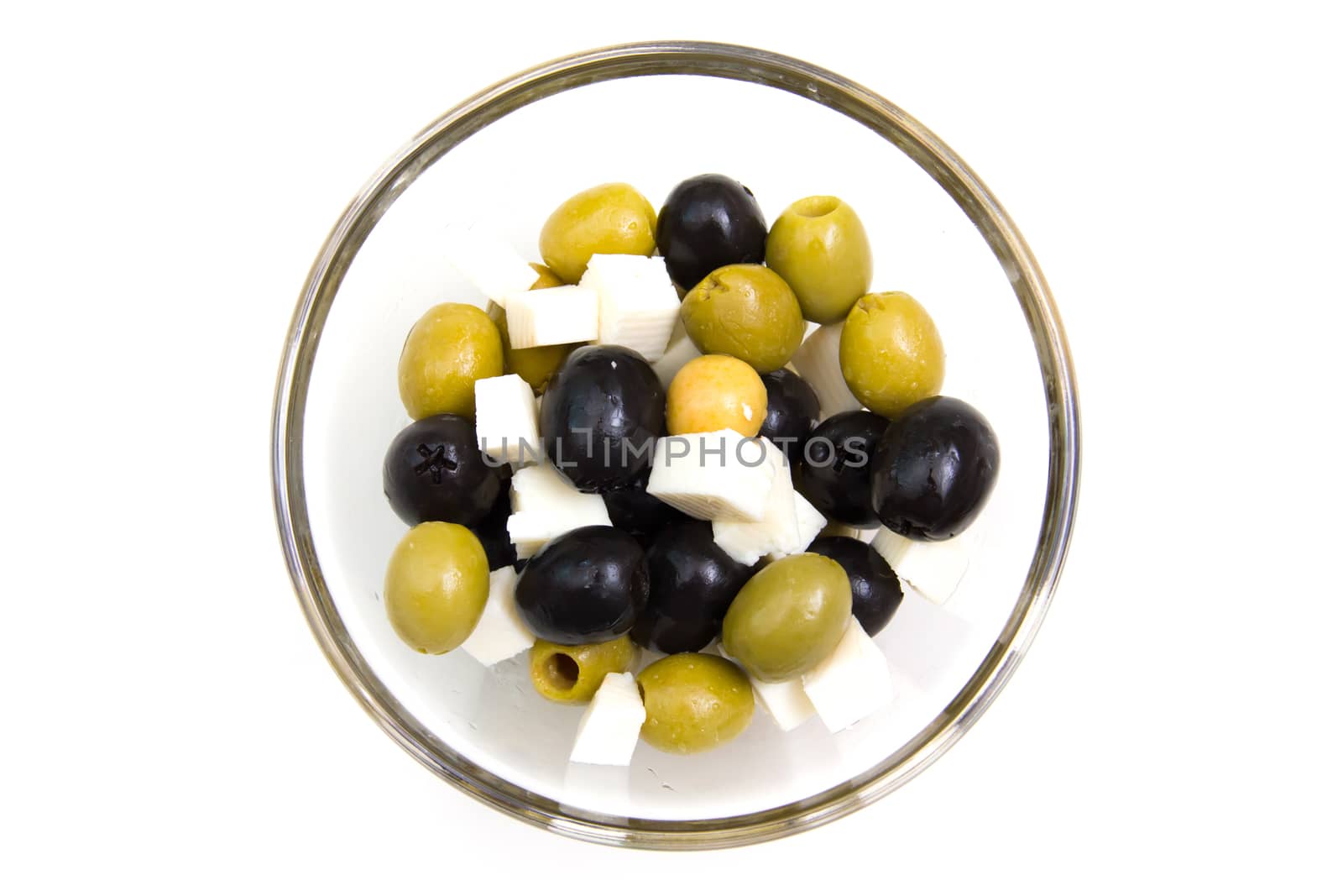 Olives with cheese on white background from above