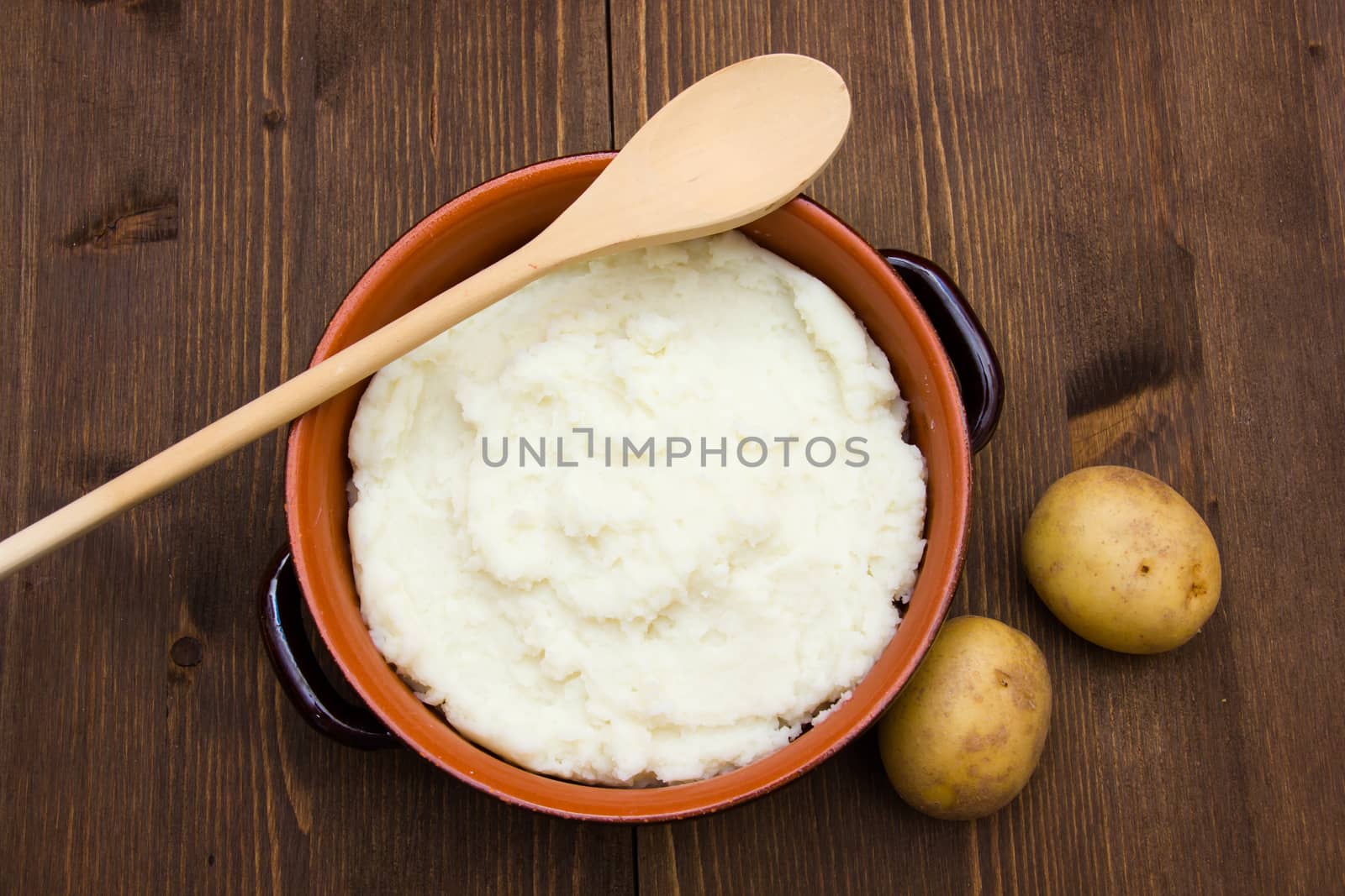Mashed potato with spoon seen from above