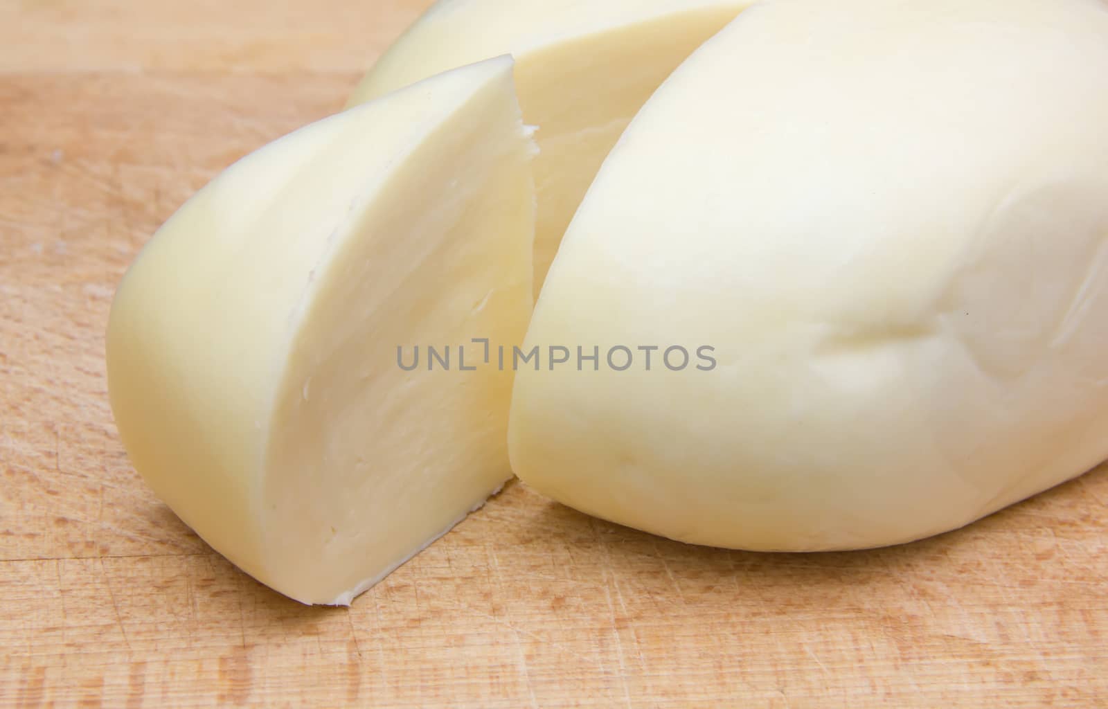Italian cheese on cutting board close up