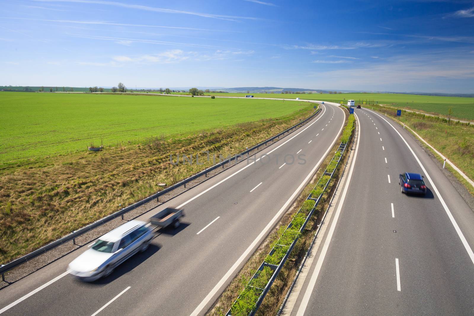 highway traffic on a lovely, sunny summer day by viktor_cap