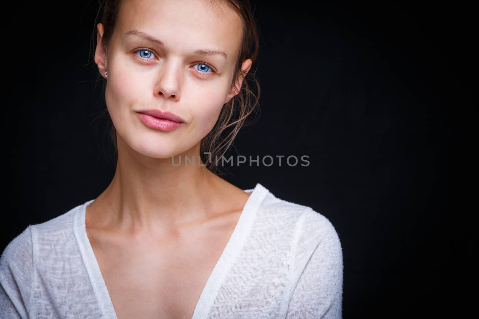 Very retty young woman's simple studio portrait, without too much retouching  (color toned image; shallow DOF)