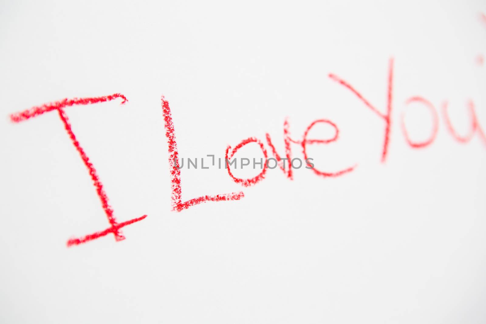 Handwritten simple words. I love You. On white paper. Creative card