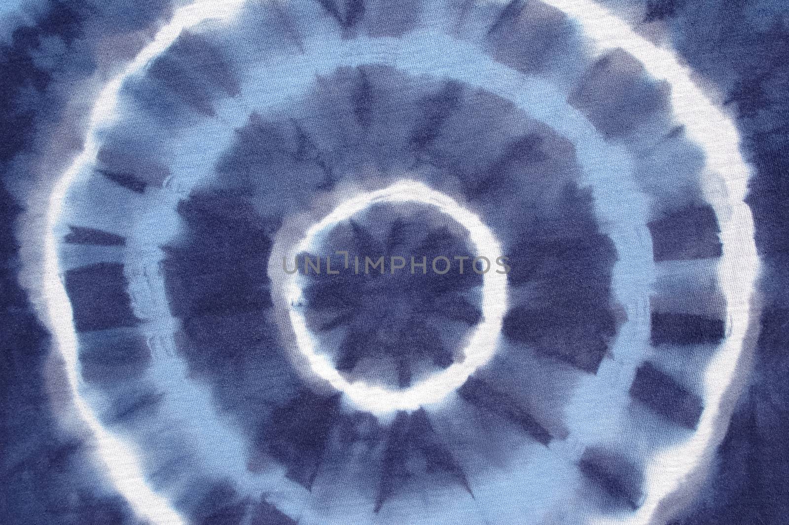 blue abstract pattern on tie dyed cotton fabric