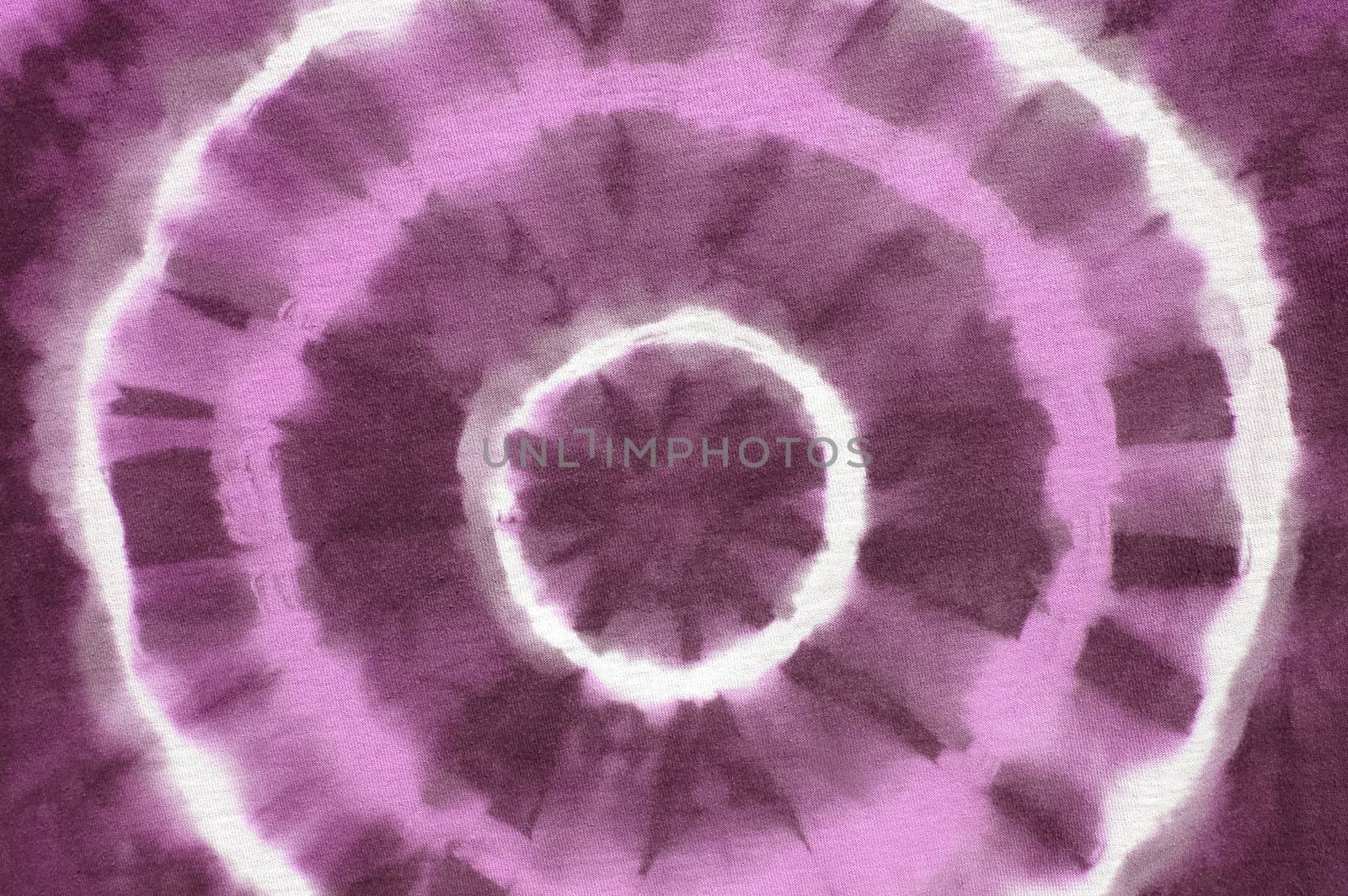 purple abstract pattern on tie dyed cotton fabric