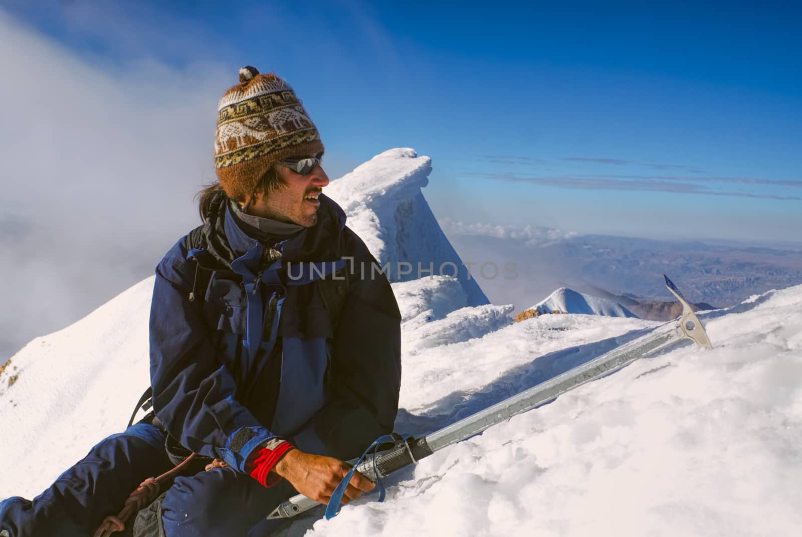 Young hiker on the top of Huayna Potosi mountain in Bolivia