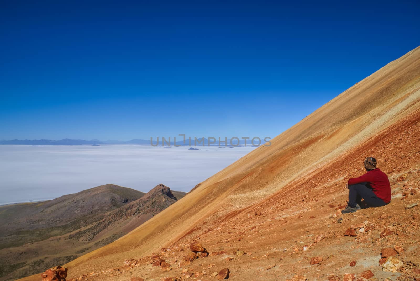 Hiker on colored mountain by MichalKnitl