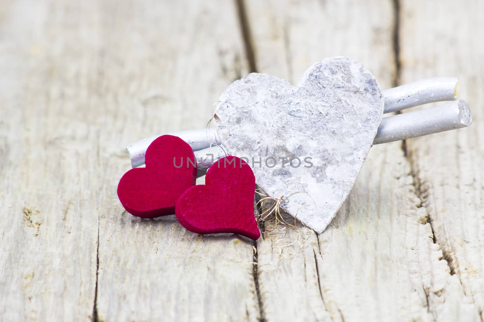 hearts on wooden background by miradrozdowski