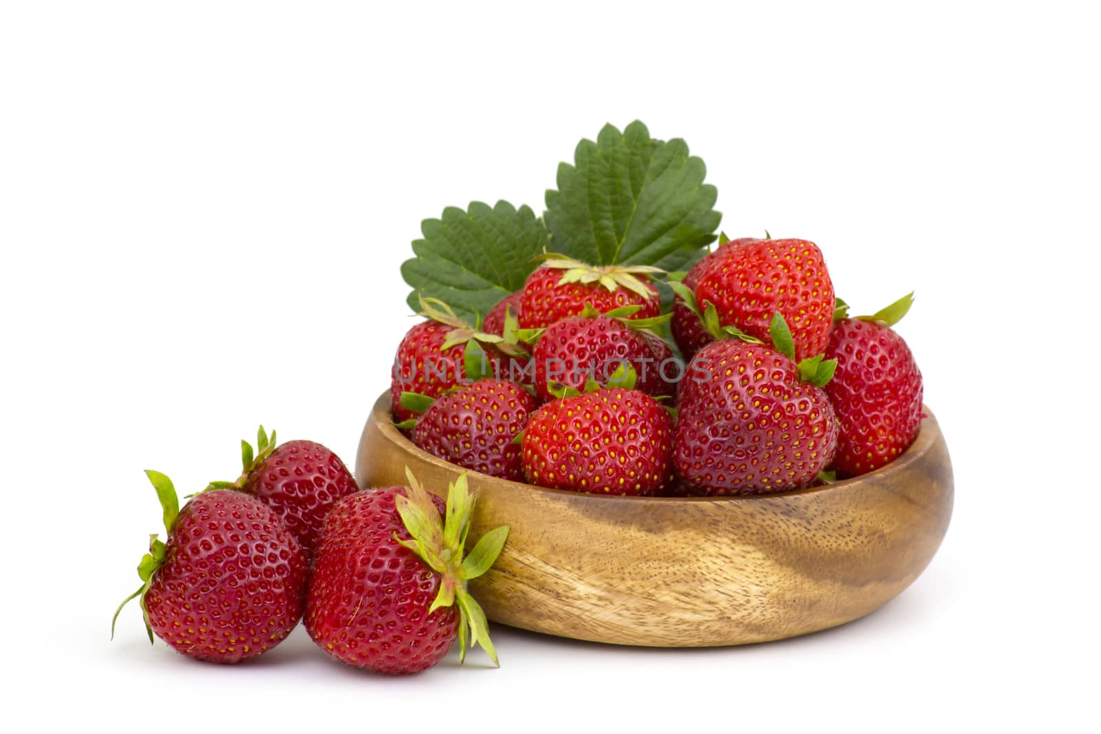 fresh strawberries in a bowl on white background