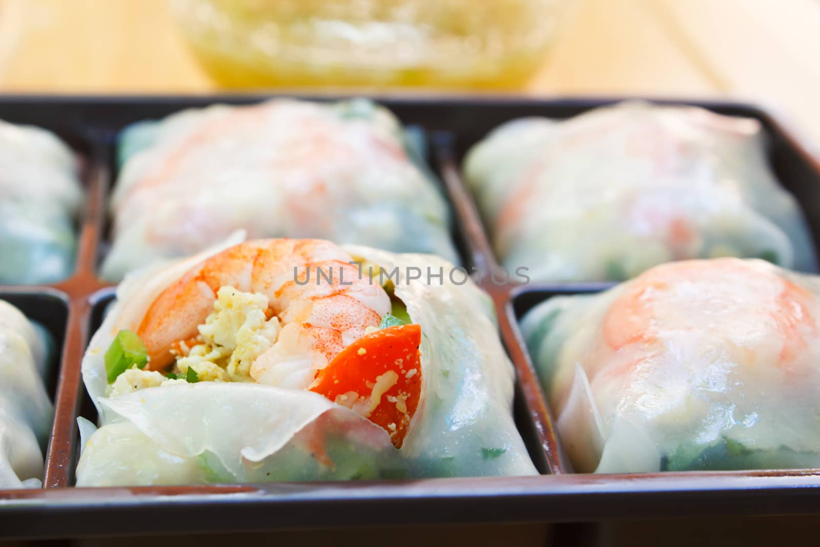 fresh noodle spring rolls with shrimp and vegetable, thailand.
