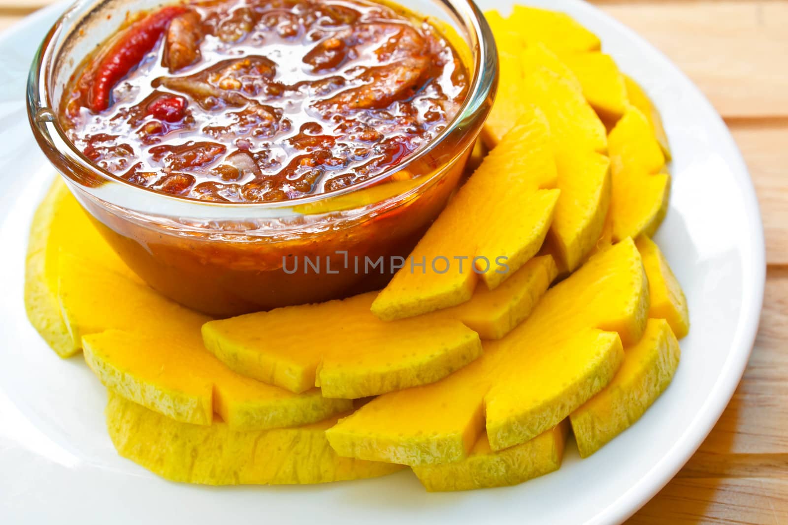 mango with sweet fish sauce, one of thailand's famous desserts.