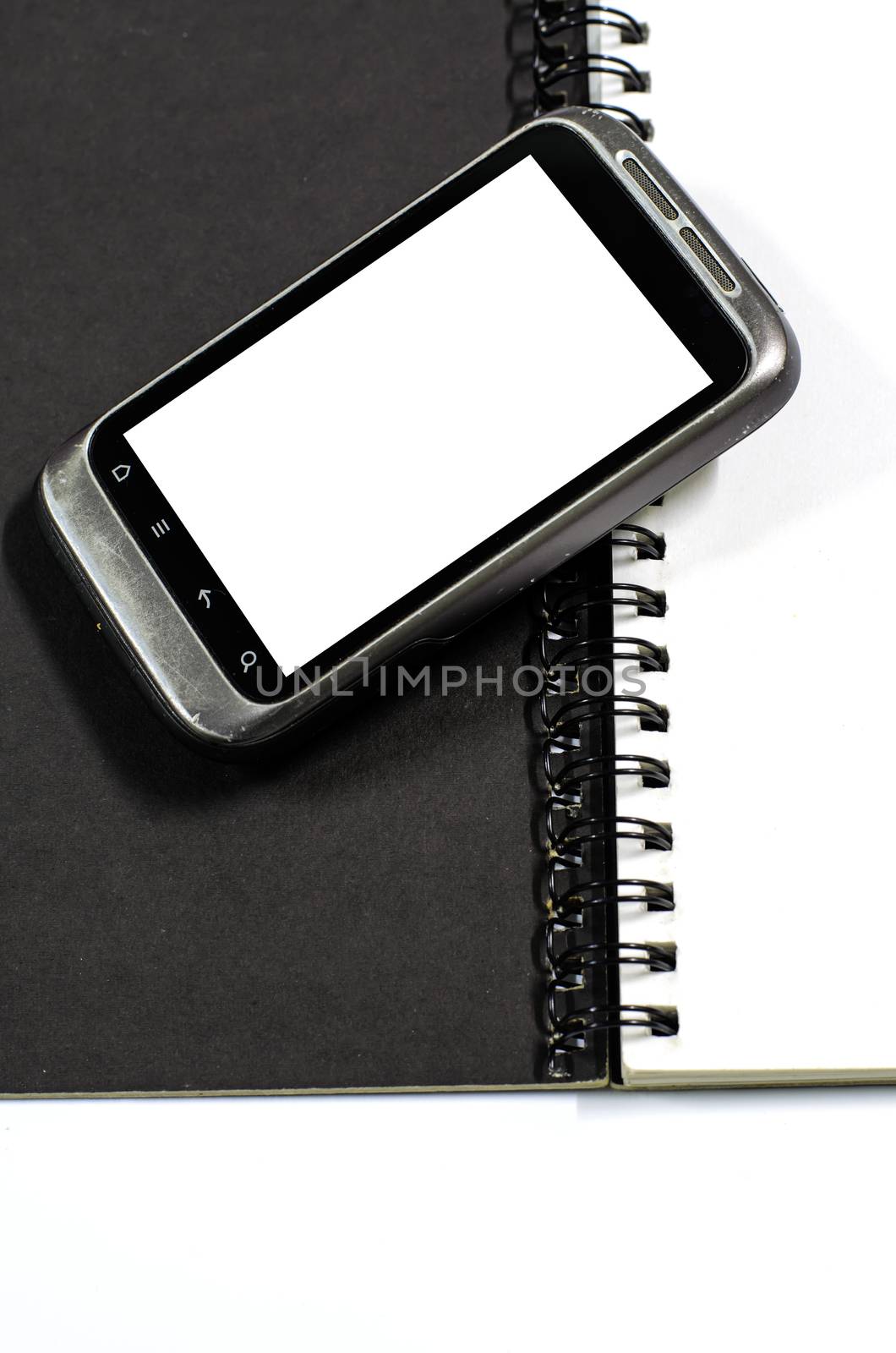 smartphone on note book by ammza12