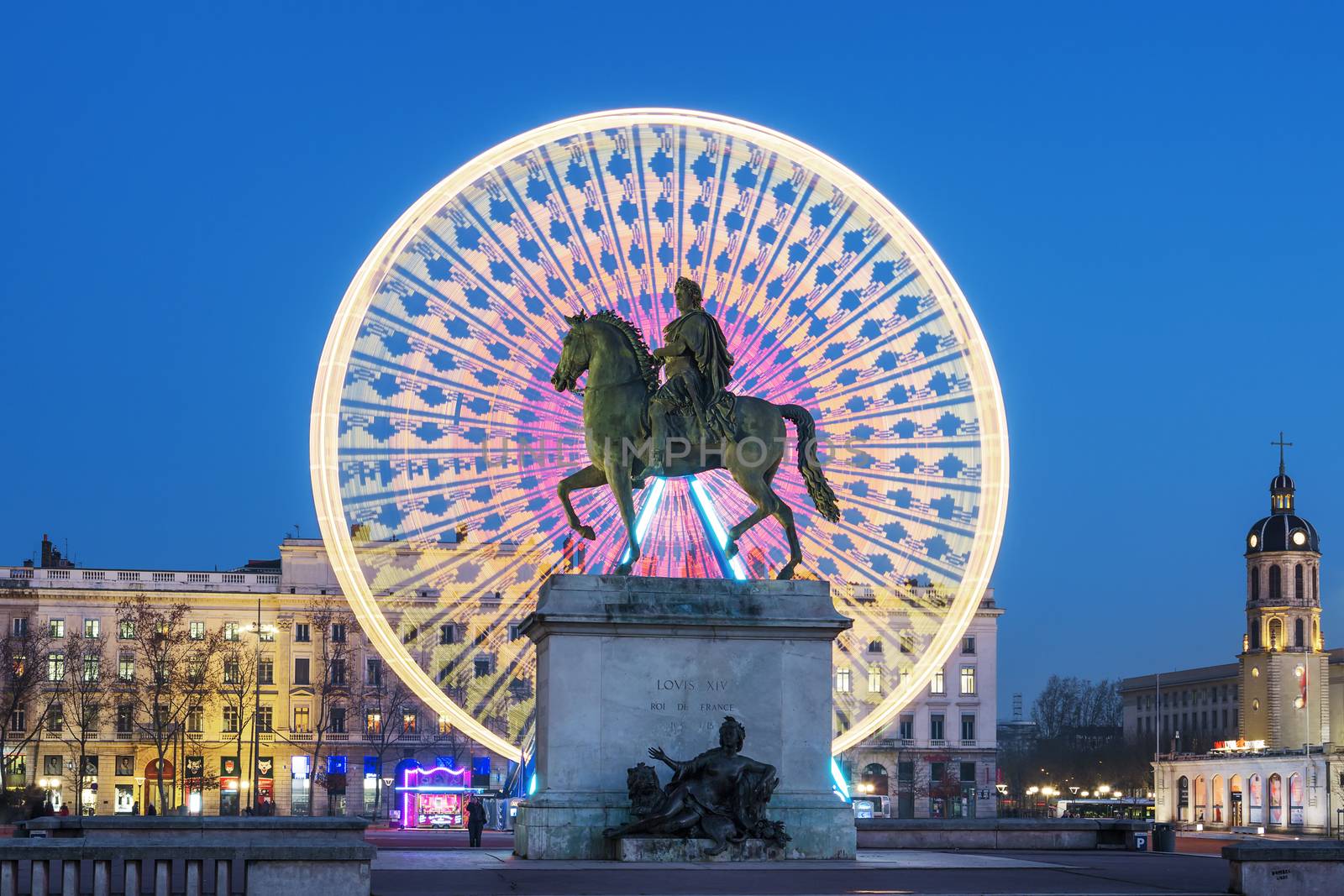 Place Bellecour, famous statue of King Louis XIV by night by vwalakte