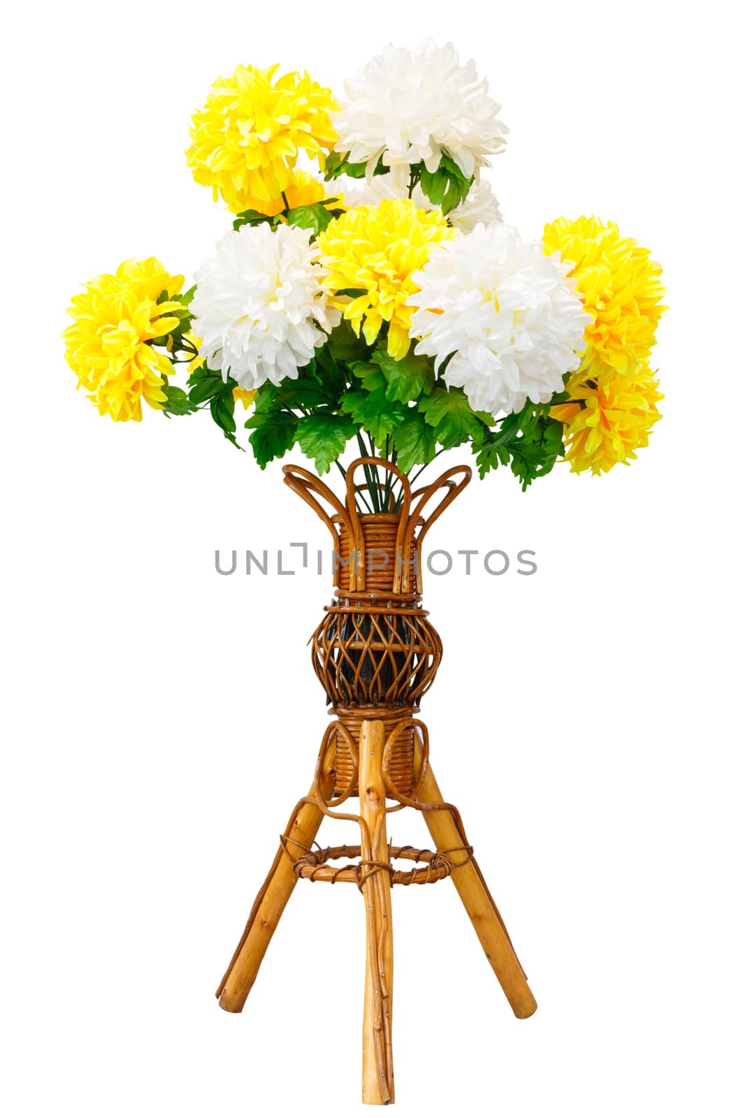 Artificial flowers and wicker wooden vase