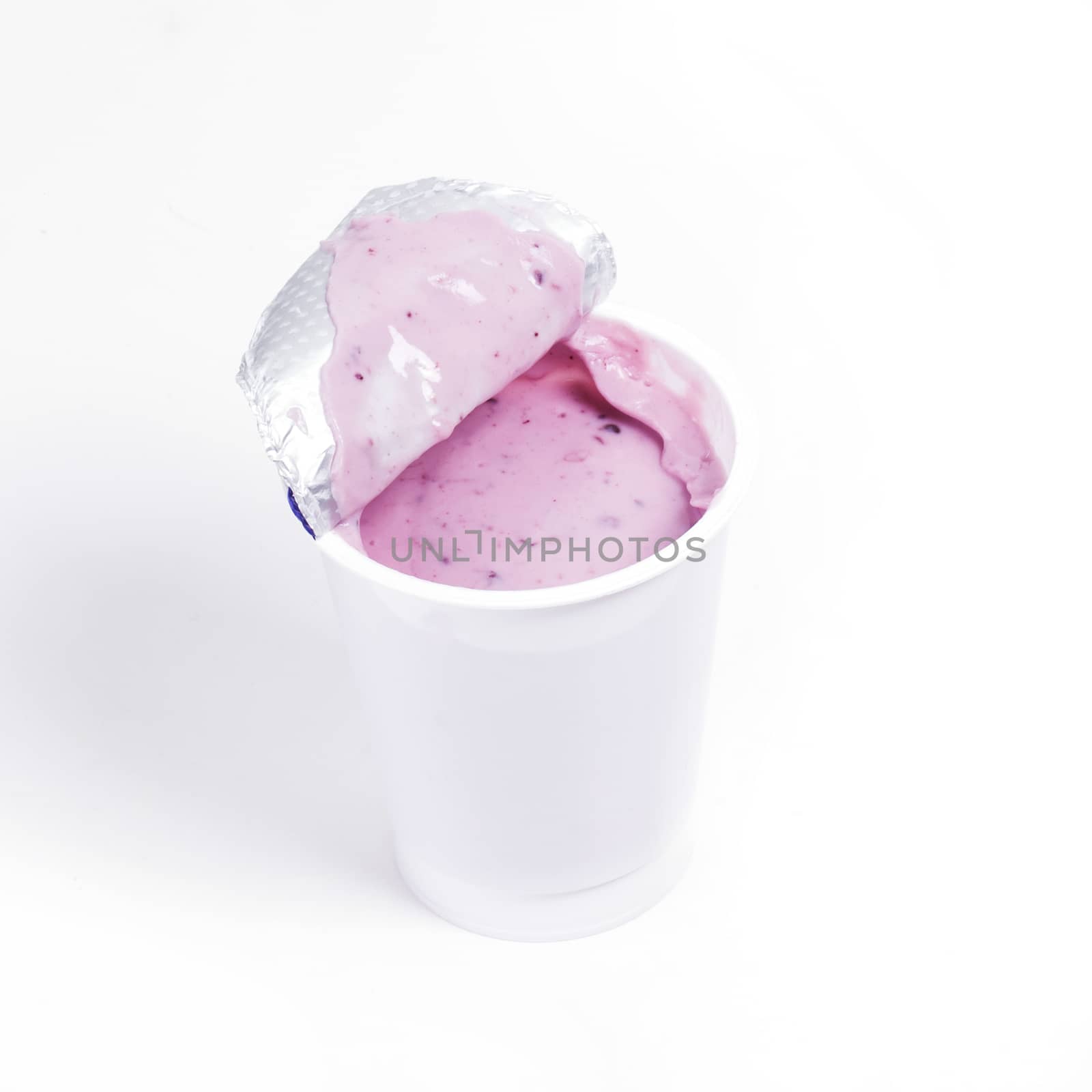 Delicious blueberry yoghurt on a white background