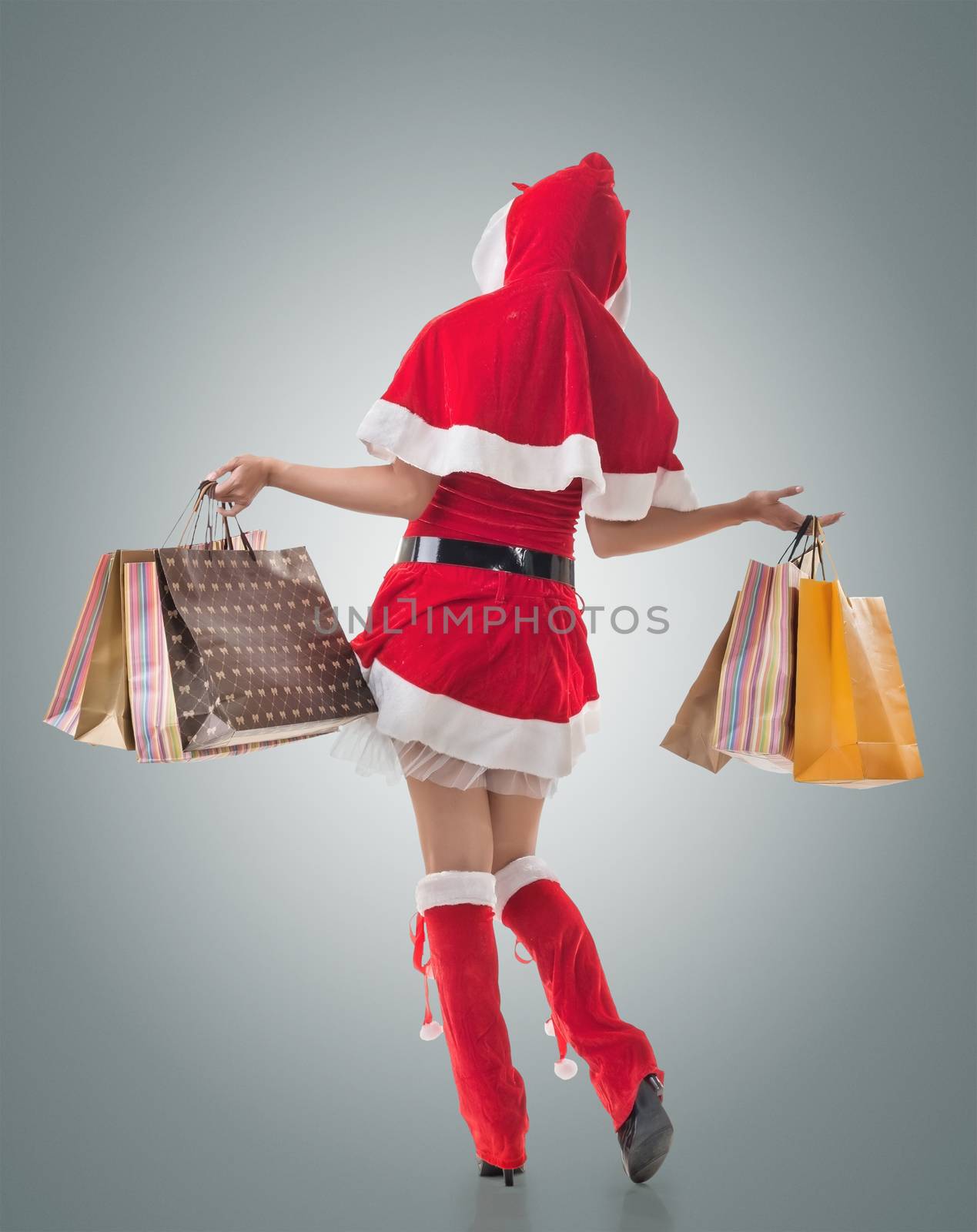 Christmas girl holding shopping bags by elwynn