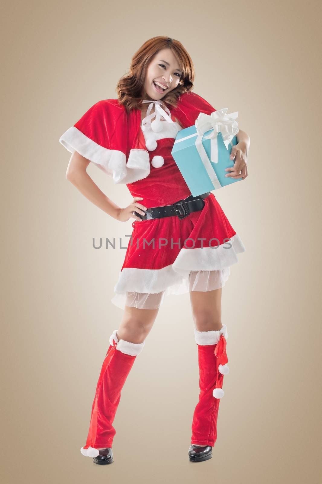 Smile happy Asian Christmas girl hold gift box by elwynn