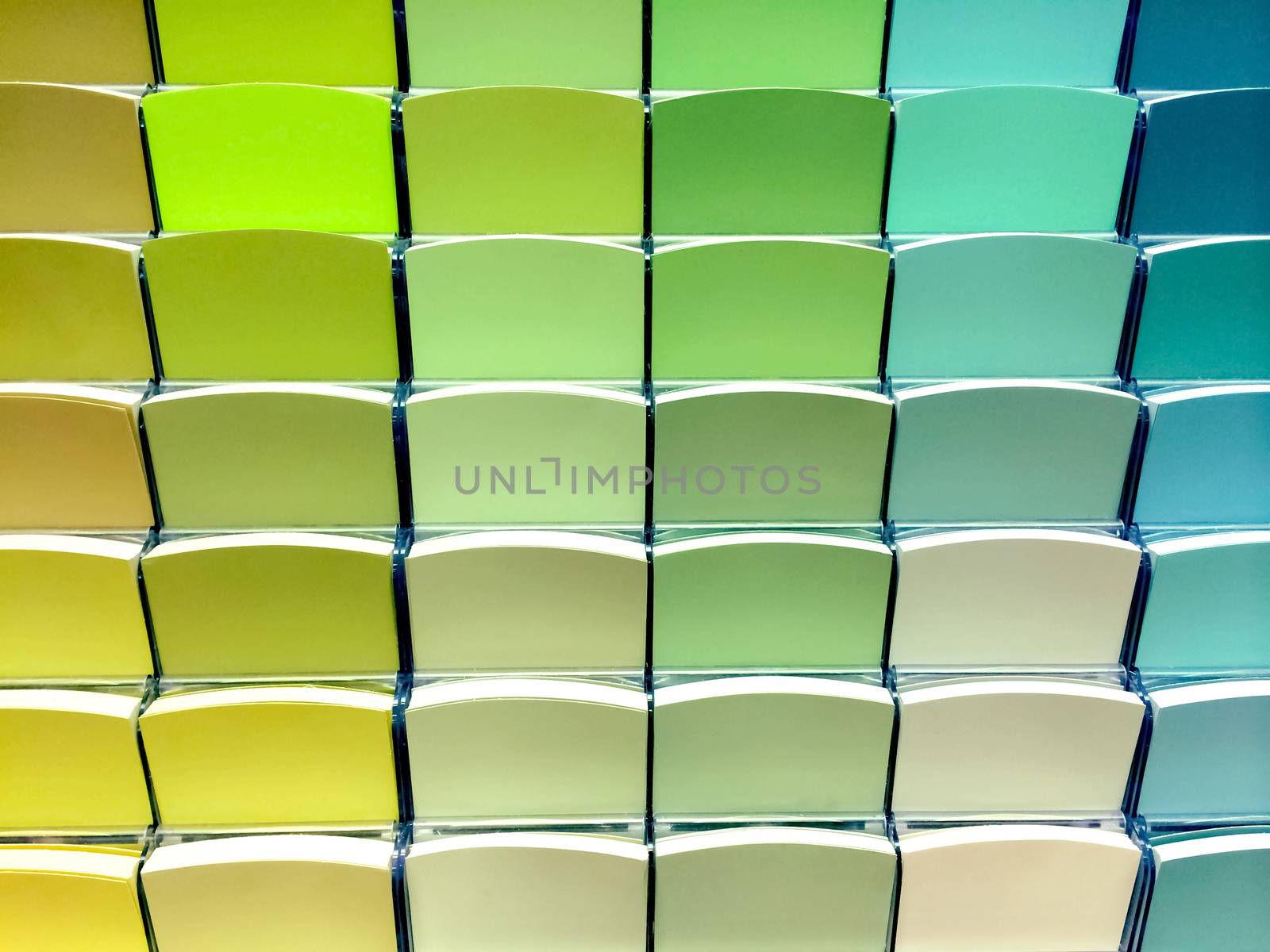 Green color swatches in a store, to choose the right paint.
