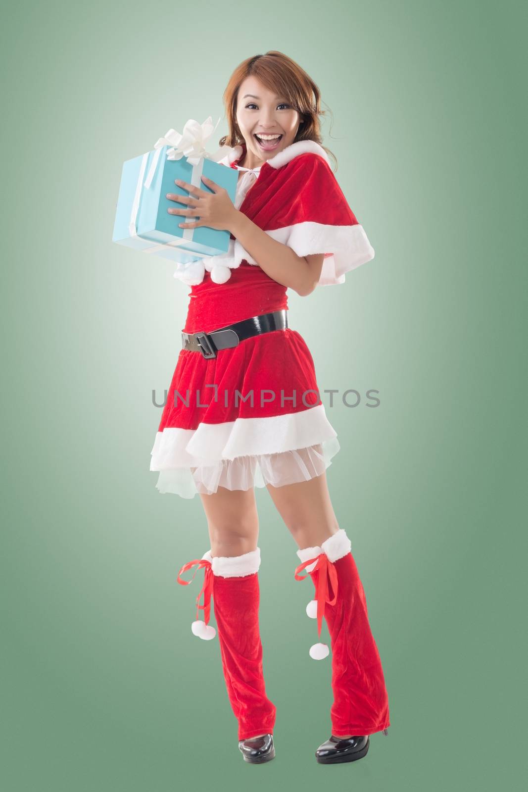 Smile happy Asian Christmas girl hold gift box by elwynn