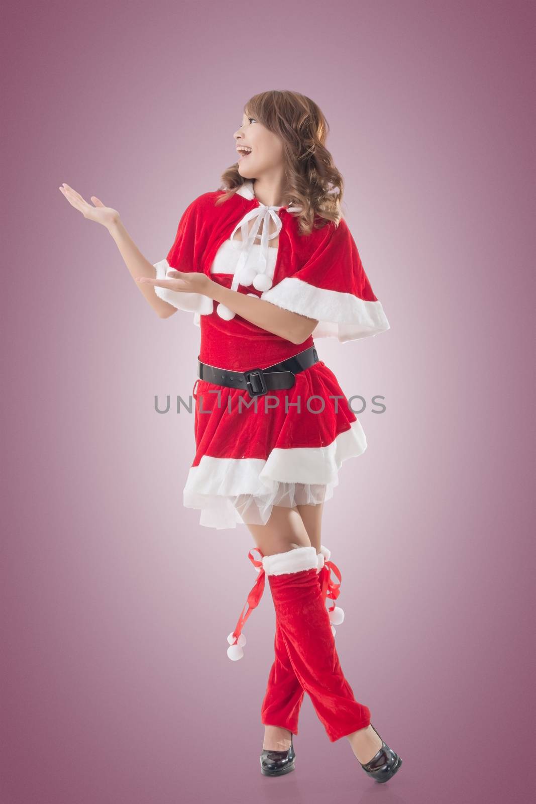 Smile happy Asian Christmas girl introduce, isolated full length portrait.