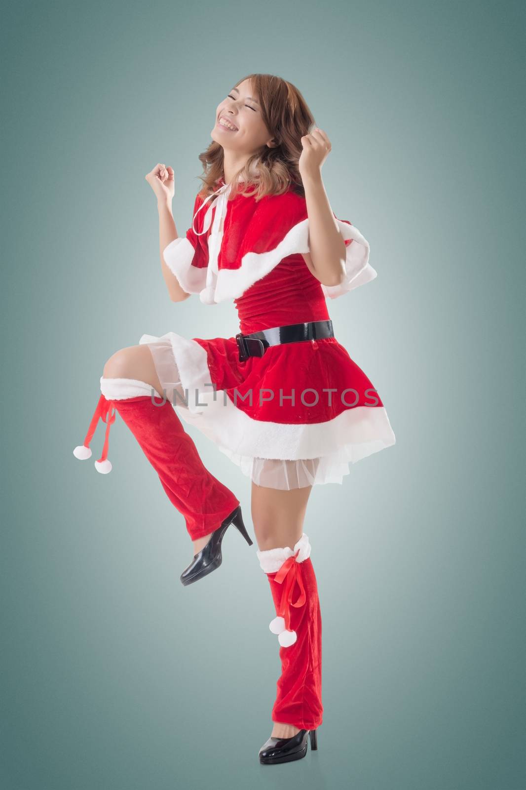 Attractive Christmas lady of Asian woman, full length portrait.