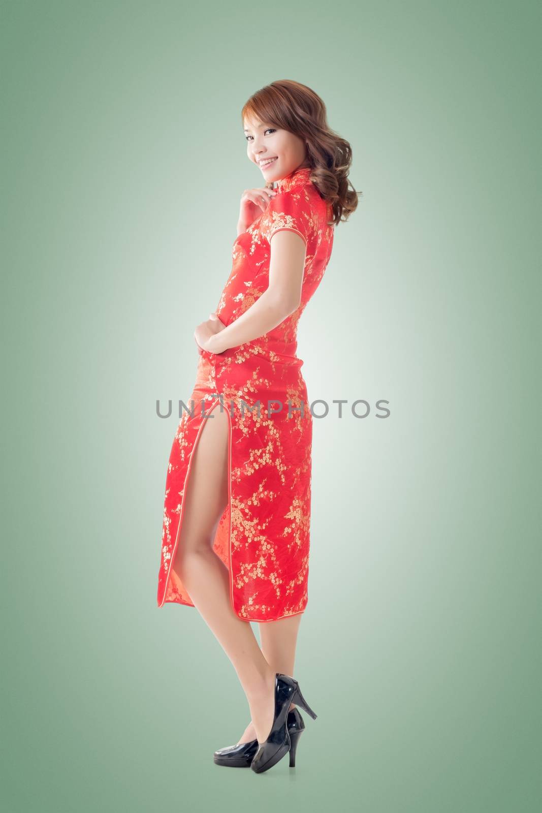 Chinese woman dress traditional cheongsam at New Year, full length portrait isolated.